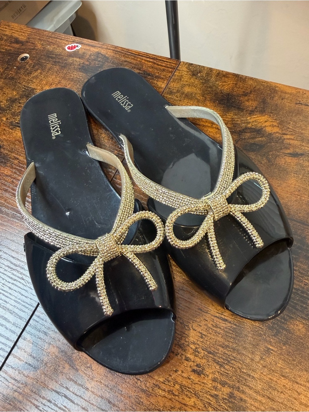 Melissa Black Jelly Slide Sandals with Gold Textured Bow Trim SZ39/US 8